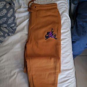Jordan Orange Sweatpants with Purple Logo